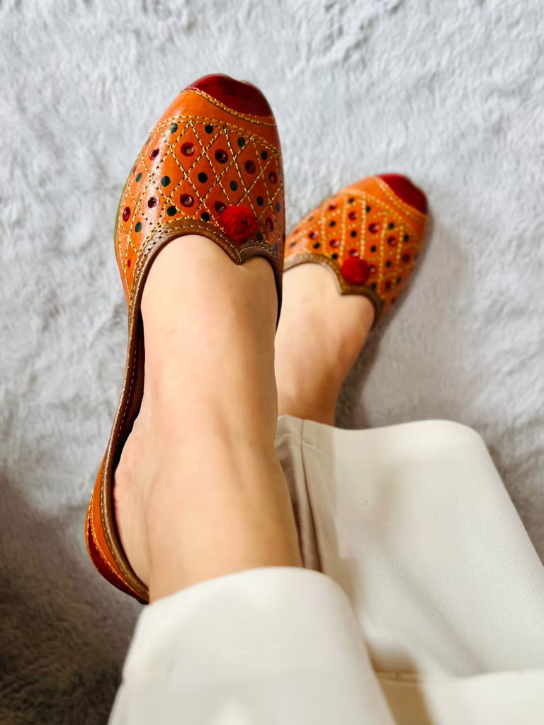 Glam Story Embroidered Leather Jutti with Pom-Pom – Handcrafted Women’s Ethnic Footwear